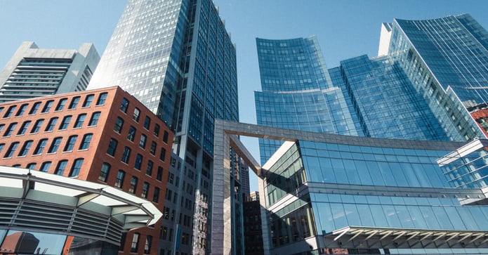 Modern commercial real estate office buildings with glass high-rise towers in a downtown business district
